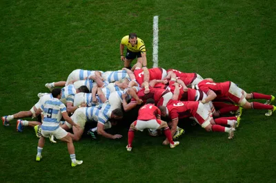 Wales' Tomos Wiliams places the ball in the scrum during the Rugby World Cup quarterfinal match between Wales and Argentina at the Stade de Marseille in Marseille, France, Saturday, Oct. 14, 2023. (AP Photo/Daniel Cole)