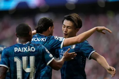 Feyenoord's Ayase Uedam, right, celebrates with teammates after scoring the opening goal of his team during the Champions League Group E soccer match between Atletico Madrid and Feyenoord at the Metropolitano stadium in Madrid, Spain, Wednesday, Oct. 4, 2023. (AP Photo/Bernat Armangue)

- XCHAMPIONSLEAGUEX
