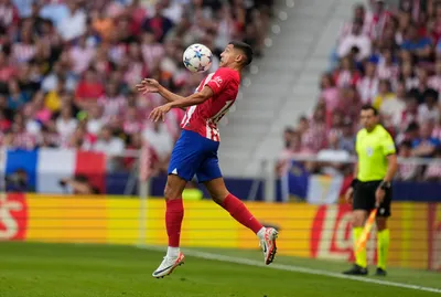 Atletico Madrid's Nahuel Molina controls the ball during the Champions League Group E soccer match between Atletico Madrid and Feyenoord at the Metropolitano stadium in Madrid, Spain, Wednesday, Oct. 4, 2023. (AP Photo/Bernat Armangue)

- XCHAMPIONSLEAGUEX