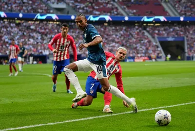 Atletico Madrid's Antoine Griezmann, background, stops Feyenoord's Calvin Stengs during the Champions League Group E soccer match between Atletico Madrid and Feyenoord at the Metropolitano stadium in Madrid, Spain, Wednesday, Oct. 4, 2023. (AP Photo/Bernat Armangue)

- XCHAMPIONSLEAGUEX