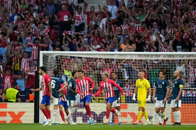 Atletico Madrid's Antoine Griezmann, center, celebrates after scoring his side's second goal during the Champions League Group E soccer match between Atletico Madrid and Feyenoord at the Metropolitano stadium in Madrid, Spain, Wednesday, Oct. 4, 2023. (AP Photo/Bernat Armangue)

- XCHAMPIONSLEAGUEX