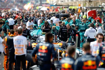 Teams work feverishly at pit lane after an aborted start due to collisions during the Brazilian Formula One Grand Prix at the Interlagos race track in Sao Paulo, Brazil, Sunday, Nov. 5, 2023. (AP Photo/Marcelo Chello, Pool)