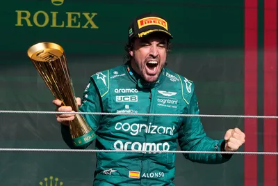 Aston Martin driver Fernando Alonso of Spain celebrates his third place on the podium at the end of the Brazilian Formula One Grand Prix at the Interlagos race track in Sao Paulo, Brazil, Sunday, Nov. 5, 2023. (AP Photo/Andre Penner)