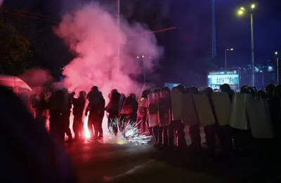 Riot Police face fans during the Euro 2024 Bulgaria v Hungary soccer match, played at closed doors, in Sofia, Thursday, Nov. 16, 2023. Thousands of Bulgarian football supporters have taken to the streets of the capital, Sofia, in protest over the management of the national football union, a demonstration that eventually turned violent. The European soccer qualifier between Bulgaria and Hungary fell victim to a bitter dispute between the management of the Bulgarian Football Union and soccer fans from across the Balkan country. (AP Photo/Valentina Petrova)
- xeuro2024x