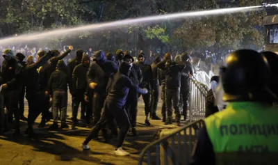 Bulgarian fans clash with police during the Euro 2024 Bulgaria v Hungary soccer match, played at closed doors, in Sofia, Thursday, Nov. 16, 2023. Thousands of Bulgarian football supporters have taken to the streets of the capital, Sofia, in protest over the management of the national football union, a demonstration that eventually turned violent. The European soccer qualifier between Bulgaria and Hungary fell victim to a bitter dispute between the management of the Bulgarian Football Union and soccer fans from across the Balkan country. (AP Photo/Valentina Petrova)
- xeuro2024x