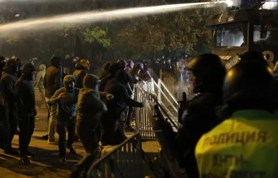 Bulgarian fans clash with police during the Euro 2024 Bulgaria v Hungary soccer match, played at closed doors, in Sofia, Thursday, Nov. 16, 2023. Thousands of Bulgarian football supporters have taken to the streets of the capital, Sofia, in protest over the management of the national football union, a demonstration that eventually turned violent. The European soccer qualifier between Bulgaria and Hungary fell victim to a bitter dispute between the management of the Bulgarian Football Union and soccer fans from across the Balkan country. (AP Photo/Valentina Petrova)
- xeuro2024x