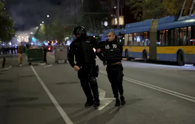 A police officer detains a supporter as Bulgarian fans clash with police during the Euro 2024 Bulgaria v Hungary soccer match, played at closed doors, in Sofia, Thursday, Nov. 16, 2023. Thousands of Bulgarian football supporters have taken to the streets of the capital, Sofia, in protest over the management of the national football union, a demonstration that eventually turned violent. The European soccer qualifier between Bulgaria and Hungary fell victim to a bitter dispute between the management of the Bulgarian Football Union and soccer fans from across the Balkan country. (AP Photo/Valentina Petrova)
- xeuro2024x