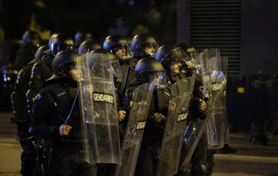 Riot police face fans during the Euro 2024 Bulgaria v Hungary soccer match, played at closed doors, in Sofia, Thursday, Nov. 16, 2023. Thousands of Bulgarian football supporters have taken to the streets of the capital, Sofia, in protest over the management of the national football union, a demonstration that eventually turned violent. The European soccer qualifier between Bulgaria and Hungary fell victim to a bitter dispute between the management of the Bulgarian Football Union and soccer fans from across the Balkan country. (AP Photo/Valentina Petrova)
- xeuro2024x