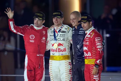 From left; Ferrari driver Charles Leclerc, of Monaco, Red Bull driver Max Verstappen, of the Netherlands, and Red Bull driver Sergio Perez, of Mexico, far right, embrace on the podium after the Formula One Las Vegas Grand Prix auto race, Sunday, Nov. 19, 2023, in Las Vegas. (AP Photo/Nick Didlick)