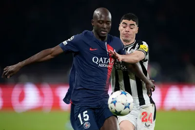 Newcastle's Miguel Almiron fights for the ball with PSG's Danilo Pereira during the Champions League group F soccer match between Paris Saint-Germain and Newcastle United FC at the Parc des Princes in Paris, Tuesday, Nov. 28, 2023. (AP Photo/Christophe Ena)

- XCHAMPIONSLEAGUEX