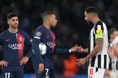 Newcastle's Jamaal Lascelles, right, talks with PSG's Kylian Mbappe after the Champions League group F soccer match between Paris Saint-Germain and Newcastle United FC at the Parc des Princes in Paris, Tuesday, Nov. 28, 2023. (AP Photo/Thibault Camus)

- XCHAMPIONSLEAGUEX
