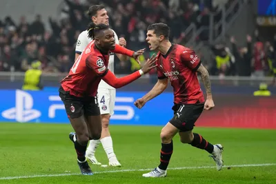 AC Milan's Rafael Leao, left, celebrates with AC Milan's Christian Pulisic after scoring a goal with an overhead kick during the Champions League group F soccer match between AC Milan and Paris Saint Germain at the San Siro stadium in Milan, Italy, Tuesday, Nov. 7, 2023. (AP Photo/Antonio Calanni)

- XCHAMPIONSLEAGUEX