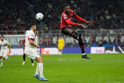 AC Milan's Rafael Leao, right, jumps for the ball ahead of PSG's Achraf Hakimi during the Champions League group F soccer match between AC Milan and Paris Saint Germain at the San Siro stadium in Milan, Italy, Tuesday, Nov. 7, 2023. (AP Photo/Antonio Calanni)

- XCHAMPIONSLEAGUEX