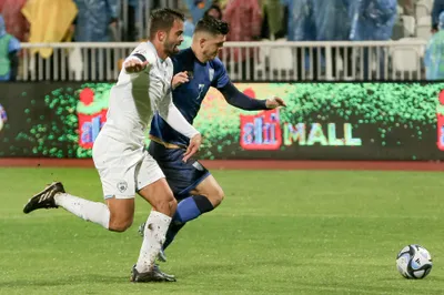 Kosovo's Milot Rashica, right, and Israel's Miguel Vitor, left, challenge for the ball during the Euro 2024 group I qualifying soccer match between Kosovo and Israel at the Fadil Vokrri stadium in Pristina, Kosovo, Sunday, Nov. 12, 2023. (AP Photo/Visar Kryeziu)

- XEURO2024X