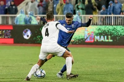 Kosovo's Milot Rashica, right, Israel's Miguel Vitor, left, challenge for the ball during the Euro 2024 group I qualifying soccer match between Kosovo and Israel at the Fadil Vokrri stadium in Pristina, Kosovo, Sunday, Nov. 12, 2023. (AP Photo/Visar Kryeziu)

- XEURO2024X
