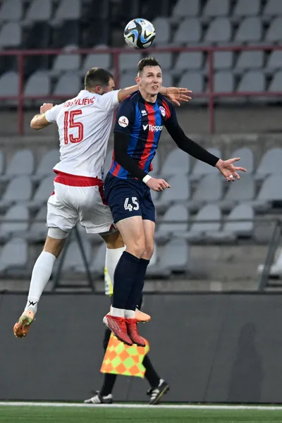 Na snímke zľava Lazar Stojsavljevič (AS Trenčín) a Filip Balaj (FC ViOn Zlaté Moravce-Vráble) bojujú o loptu v zápase 18. kola futbalovej Niké ligy AS Trenčín – FC ViOn Zlaté Moravce-Vráble v Trenčíne v sobotu 16. decembra 2023. FOTO TASR - Radovan Stoklasa 

- Slovensko šport futbal NL Niké liga muži
- 18. kolo AS Trenčín – FC ViOn Zlaté Moravce-Vráble 
- TNX