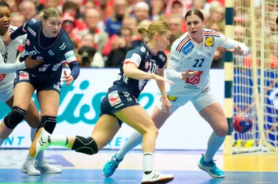 France's Tamara Horacek, right, and Norway's Stine Oftedal, center, vie for the ball, during Women's Handball Championship  Handball final match between Norway and France,  at Jyske Bank Boxen, in Herning, Denmark, Sunday, Dec. 17, 2023. (Claus Fisker/ Ritzau Scanpix via AP)