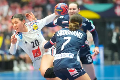 France's goalkeeper Laura Flippes, left, vies for the ball, during the Women's Handball Championship  Handball final match between Norway and France, at Jyske Bank Boxen, in Herning, Denmark, Sunday, Dec. 17, 2023. (Claus Fisker/ Ritzau Scanpix via AP)