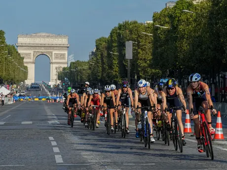Riders on the first bike leg compete on the Champs Elysee avenue of the women's triathlon test event for the Paris 2024 Olympic Games in Paris, Thursday, Aug. 17, 2023. (AP Photo/Michel Euler, File)