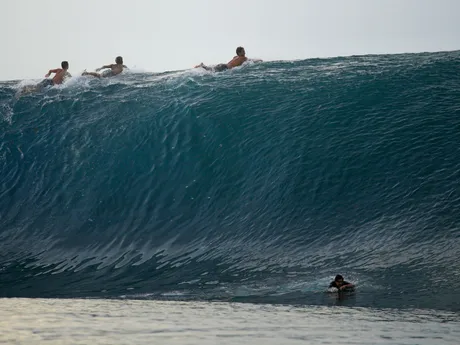 Surfers paddle over the top of a wave in Teahupo'o, Tahiti, French Polynesia, Sunday, Jan. 13, 2024. Teahupo'o will host the surfing competitions during the Paris 2024 Olympic Games. (AP Photo/Daniel Cole, File)

- Climate;climate change;surfing;olympics;2024 Paris Olympics;Olympic Games;Tahiti;environment;reef