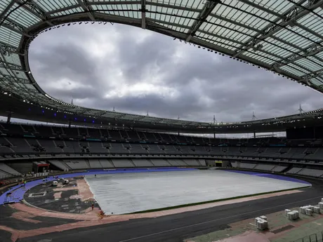 The purple athletics track at the Olympic Stadium, currently known as Stade de France, is being installed, in Saint-Denis, north of Paris, Tuesday, April 9, 2024. The Olympic Stadium will host the athletics events at the Paris 2024 Olympic Games. (AP Photo/Aurelien Morissard, File)