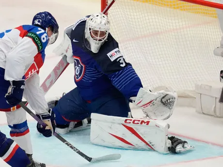 France's goalkeeper Sebastian Ylonen, right, makes a save in front of Slovakia's Martin Pospisil during the preliminary round match between France and Slovakia at the Ice Hockey World Championships in Ostrava, Czech Republic, Saturday, May 18, 2024. (AP Photo/Darko Vojinovic)