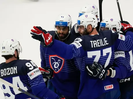 France's Sacha Treille celebrates with teammates after scoring his side's opening goal during the preliminary round match between France and Slovakia at the Ice Hockey World Championships in Ostrava, Czech Republic, Saturday, May 18, 2024. (AP Photo/Darko Vojinovic)