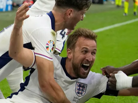 England's Harry Kane celebrates after scoring his side's second goal during a round of sixteen match between England and Slovakia at the Euro 2024 soccer tournament in Gelsenkirchen, Germany, Sunday, June 30, 2024. (AP Photo/Thanassis Stavrakis)

- XEURO2024X