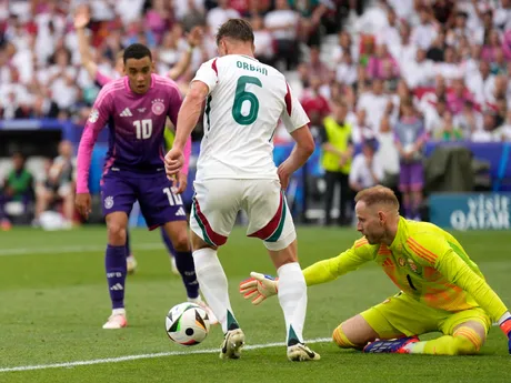 Hungary's Willi Orban, centre, controls the ball ahead Hungary's goalkeeper Peter Gulacsi, right, and Germany's Jamal Musiala during a Group A match between Germany and Hungary at the Euro 2024 soccer tournament in Stuttgart, Germany, Wednesday, June 19, 2024. (AP Photo/Ariel Schalit)

- XEURO2024X