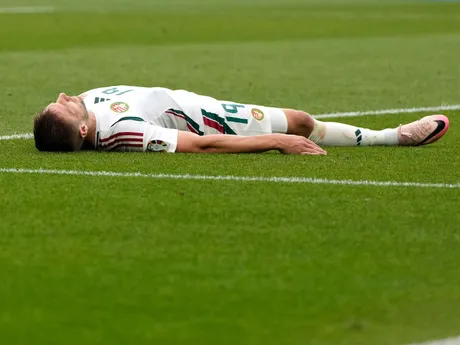 Hungary's Barnabas Varga lies on the pitch after missing a scoring chance during a Group A match between Germany and Hungary at the Euro 2024 soccer tournament in Stuttgart, Germany, Wednesday, June 19, 2024. (AP Photo/Antonio Calanni)

- XEURO2024X