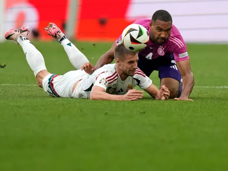 Germany's Jonathan Tah (40 and Hungary's Bendeguz Bolla battle for the ball during a Group A match between Germany and Hungary at the Euro 2024 soccer tournament in Stuttgart, Germany, Wednesday, June 19, 2024. (AP Photo/Matthias Schrader)

- XEURO2024X