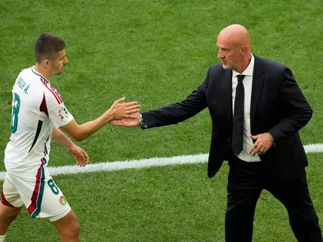 Hungary's Adam Nagy, left, is greeted by coach Marco Rossi during a Group A match between Germany and Hungary at the Euro 2024 soccer tournament in Stuttgart, Germany, Wednesday, June 19, 2024. (AP Photo/Themba Hadebe)

- XEURO2024X