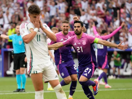 Germany's Ilkay Gundogan, right, celebrates after scoring his side's second goal during a Group A match between Germany and Hungary at the Euro 2024 soccer tournament in Stuttgart, Germany, Wednesday, June 19, 2024. (AP Photo/Ariel Schalit)

- XEURO2024X