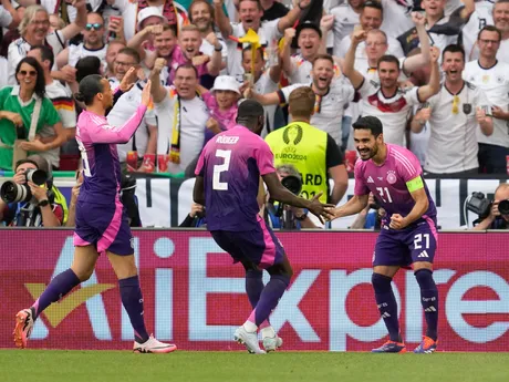 Germany's Ilkay Gundogan, right, celebrates with teammates after scoring during a Group A match between Germany and Hungary at the Euro 2024 soccer tournament in Stuttgart, Germany, Wednesday, June 19, 2024. (AP Photo/Darko Vojinovic)

- XEURO2024X