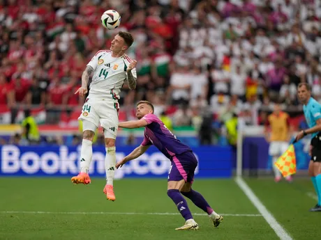 Hungary's Bendeguz Bolla (14) heads the bal over Germany's Maximilian Mittelstadt during a Group A match between Germany and Hungary at the Euro 2024 soccer tournament in Stuttgart, Germany, Wednesday, June 19, 2024. (AP Photo/Matthias Schrader)

- XEURO2024X