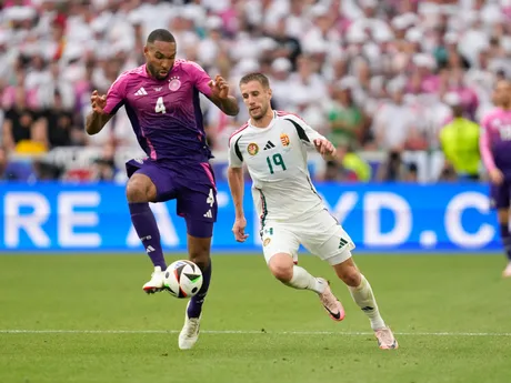 Germany's Jonathan Tah, left, controls the ball next to Hungary's Barnabas Varga during a Group A match between Germany and Hungary at the Euro 2024 soccer tournament in Stuttgart, Germany, Wednesday, June 19, 2024. (AP Photo/Darko Vojinovic)

- XEURO2024X