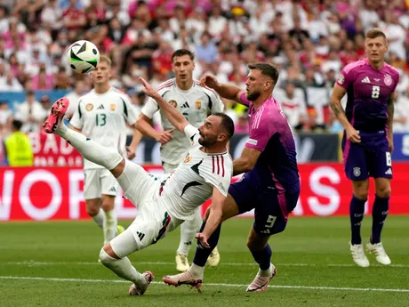 Hungary's Attila Fiola, left, clears the ball ahead of Germany's Niclas Fuellkrug (9) during a Group A match between Germany and Hungary at the Euro 2024 soccer tournament in Stuttgart, Germany, Wednesday, June 19, 2024. (AP Photo/Matthias Schrader)

- XEURO2024X
