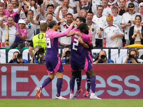 Germany's Ilkay Gundogan, right, celebrates with teammates after scoring during a Group A match between Germany and Hungary at the Euro 2024 soccer tournament in Stuttgart, Germany, Wednesday, June 19, 2024. (AP Photo/Darko Vojinovic)

- XEURO2024X