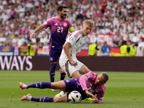 Hungary's Andras Schafer left, challenges for the ball with Germany's Leroy Sane during a Group A match between Germany and Hungary at the Euro 2024 soccer tournament in Stuttgart, Germany, Wednesday, June 19, 2024. (AP Photo/Antonio Calanni)

- XEURO2024X
