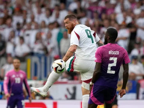 Hungary's Martin Adam, left, challenges for the ball with Germany's Antonio Ruediger during a Group A match between Germany and Hungary at the Euro 2024 soccer tournament in Stuttgart, Germany, Wednesday, June 19, 2024. (AP Photo/Antonio Calanni)

- XEURO2024X