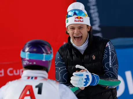 Brazil's Lucas Pinheiro Braathen congratulates Norway's Atle Lie McGrath, back to camera, at the finish area of an alpine ski, men's World Cup giant slalom, in Soelden, Austria, Sunday, Oct. 27, 2024. (AP Photo/Alessandro Trovati)