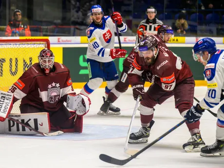 Eriks Vitols, Haralds Egle (obaja Lotyšsko) a Adam Lukošik (Slovensko) počas Vianočného Kaufland Cupu v hokeji Slovensko - Lotyšsko.