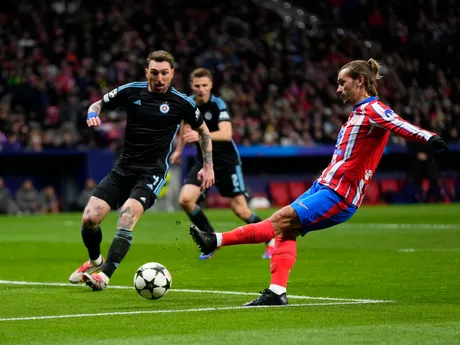 Atletico Madrid's Antoine Griezmann scores his side's third goal during the Champions League opening phase soccer match between Atletico Madrid and Slovan Bratislava at Riyadh Air Metropolitano stadium in Madrid, Spain, Wednesday, Dec. 11, 2024. (AP Photo/Manu Fernandez)

- XCHAMPIONSLEAGUEX