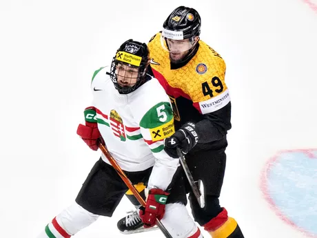 Germany's Lukas KĂ¤lbie, right, and Hungary's Doman Szongoth in action during the group B IIHF Ice Hockey World Championships match between Germany and Hungary in Herning, Denmark, Saturday May 10, 2025. (Henning Bagger/Ritzau Scanpix via AP)