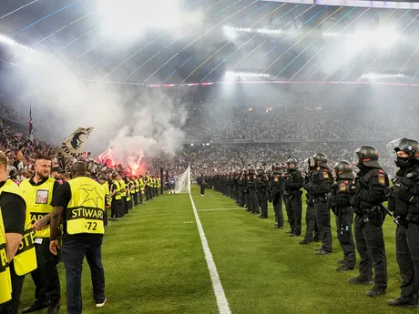 Police officials stand guard at the end of the Champions League final soccer match between Paris Saint-Germain and Inter Milan at the Allianz Arena in Munich, Germany, Saturday, May 31, 2025. (AP Photo/Martin Meissner)

- XCHAMPIONSLEAGUEX