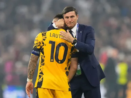 Former Inter Milan player Javier Zanetti, right, hugs Inter Milan's team captain Lautaro Martinez at the end of the Champions League final soccer match between Paris Saint-Germain and Inter Milan at the Allianz Arena in Munich, Germany, Saturday, May 31, 2025. (AP Photo/Luca Bruno)

- XCHAMPIONSLEAGUEX