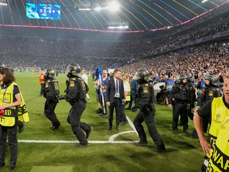 Police officials stand guard at the end of the Champions League final soccer match between Paris Saint-Germain and Inter Milan at the Allianz Arena in Munich, Germany, Saturday, May 31, 2025. (AP Photo/Martin Meissner)

- XCHAMPIONSLEAGUEX
