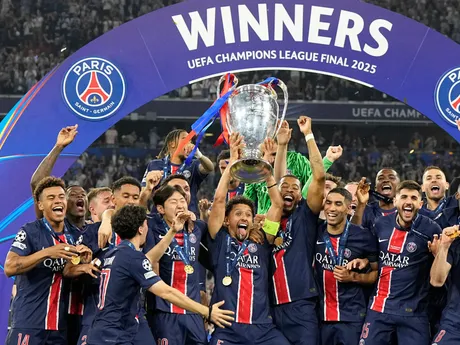 PSG's Marquinhos holds up the trophy as he celebrates with his teammates after winning the Champions League final soccer match between Paris Saint-Germain and Inter Milan at the Allianz Arena in Munich, Germany, Saturday, May 31, 2025. (AP Photo/Martin Meissner)

- XCHAMPIONSLEAGUEX