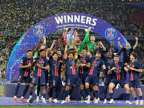 PSG's Marquinhos holds up the trophy as he celebrates with his teammates after winning the Champions League final soccer match between Paris Saint-Germain and Inter Milan at the Allianz Arena in Munich, Germany, Saturday, May 31, 2025. (AP Photo/Martin Meissner)

- XCHAMPIONSLEAGUEX