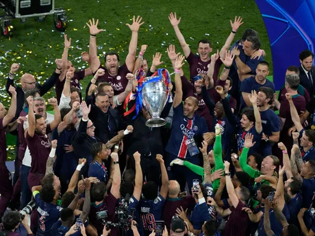 Players of PSG lift the trophy after winning the Champions League tournament at the Allianz Arena in Munich, Germany, Saturday, May 31, 2025. (AP Photo/Michael Probst)

- XCHAMPIONSLEAGUEX